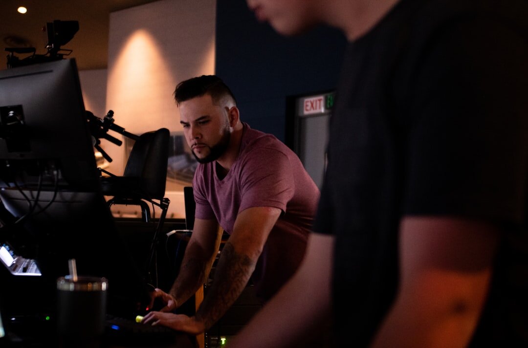 Television production team reviewing footage together in studio