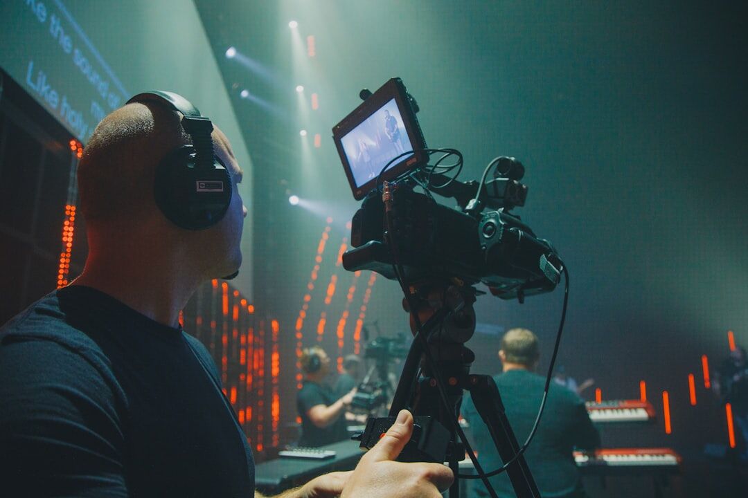Camera operator panning a broadcast camera during live show